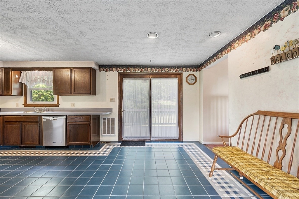 4 Ridgemont Drive Londonderry, NH 03053 - Photo 9 of 33 a view of a hallway with entryway and kitchen