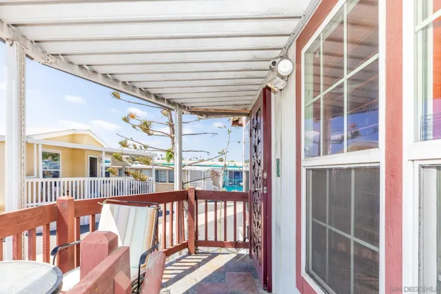a view of a porch with wooden floor