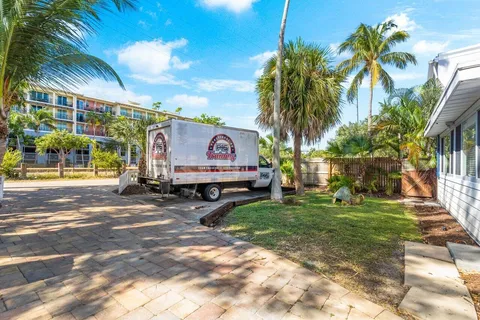 a view of a house with sitting area and garden