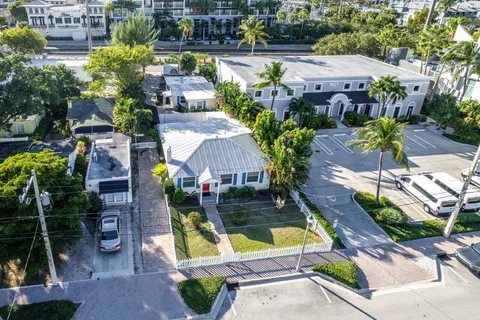 an aerial view of house with swimming pool yard and outdoor seating