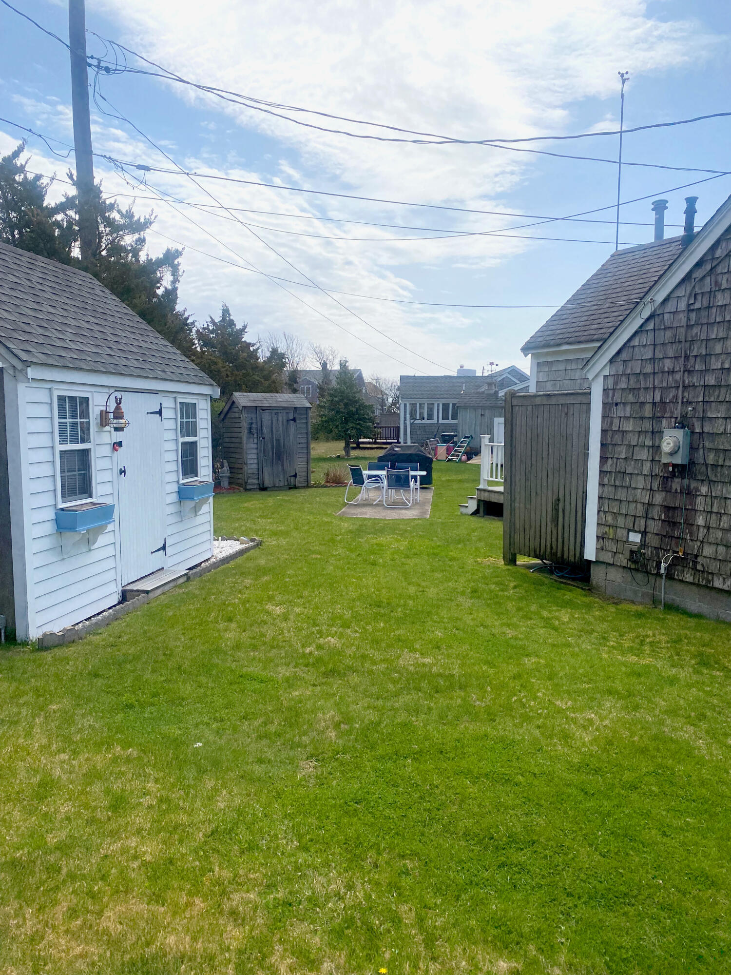 1090 Craigville Beach Road Centerville, MA 02632 - Photo 11 of 33 a view of a backyard with sitting area