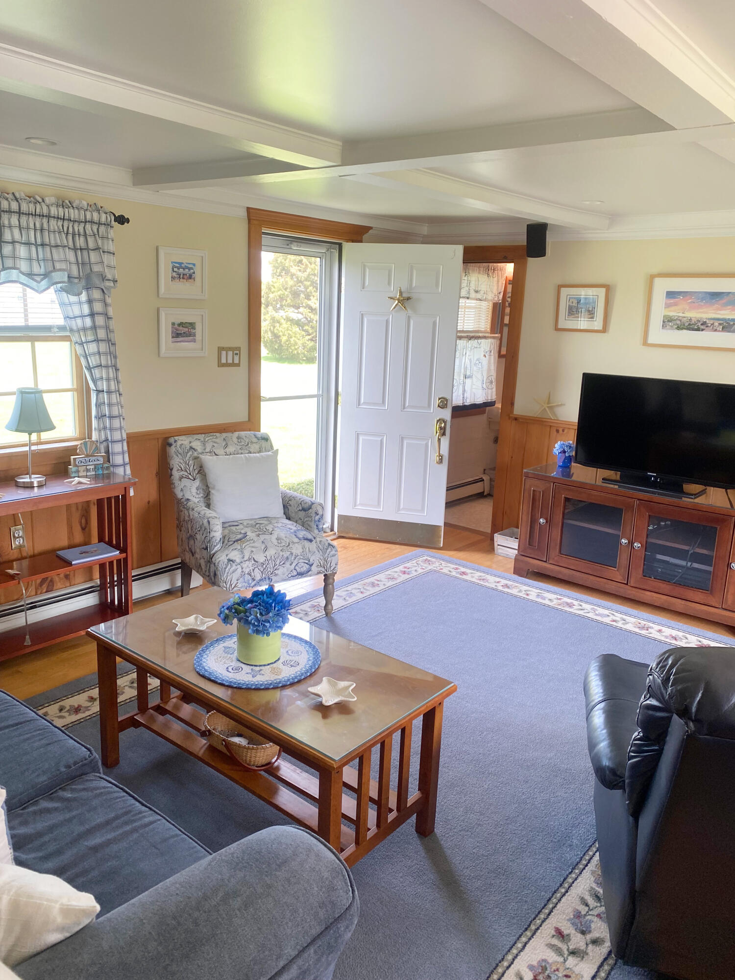 1090 Craigville Beach Road Centerville, MA 02632 - Photo 16 of 33 a living room with furniture and a flat screen tv