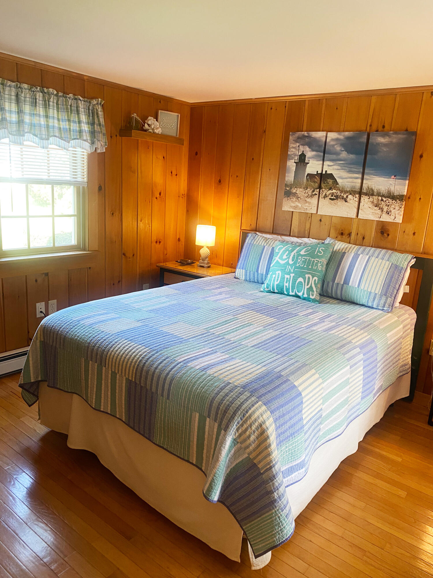 1090 Craigville Beach Road Centerville, MA 02632 - Photo 18 of 33 a bedroom with a bed and window