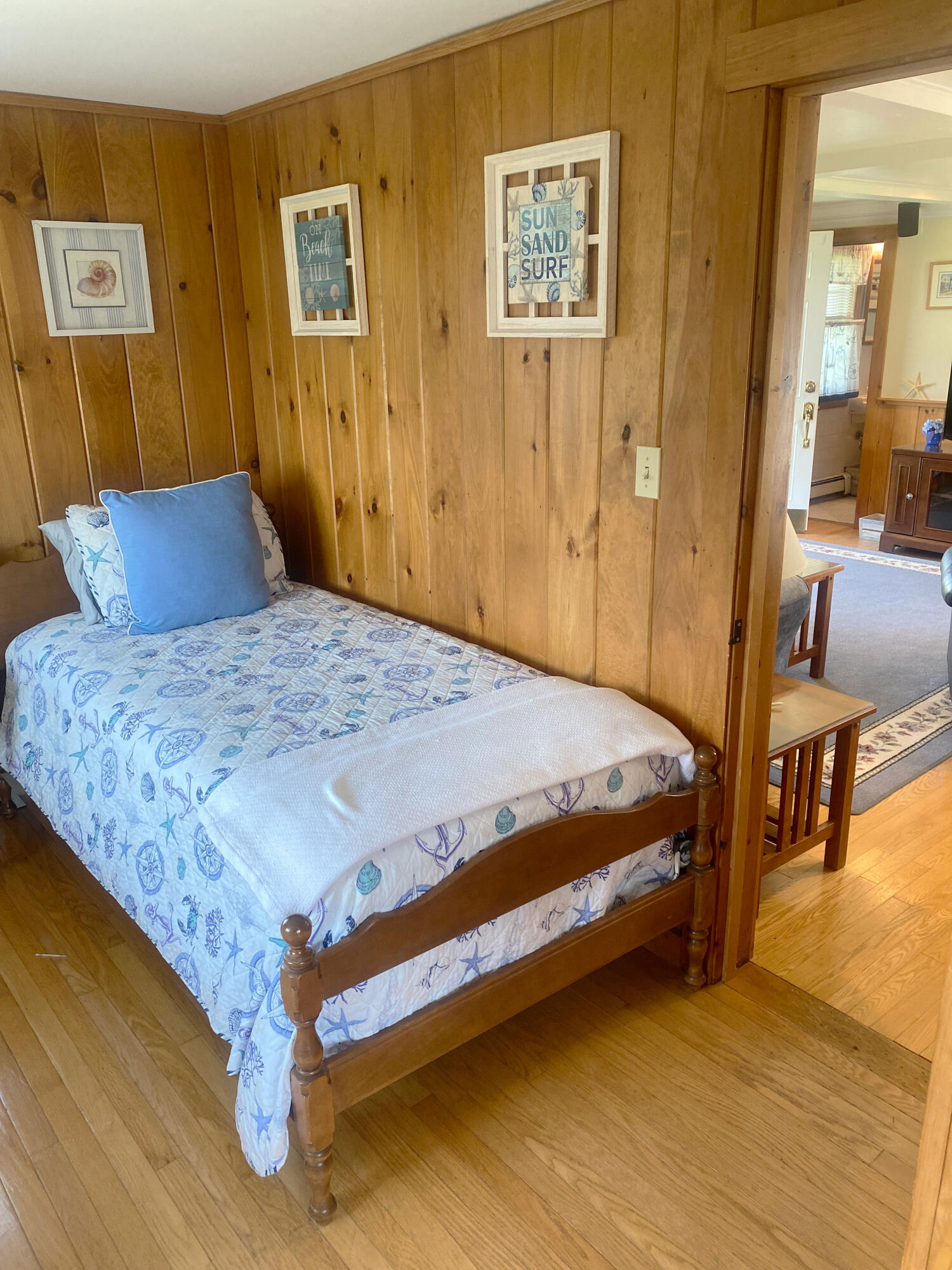 1090 Craigville Beach Road Centerville, MA 02632 - Photo 19 of 33 a bedroom with a bed and cupboard