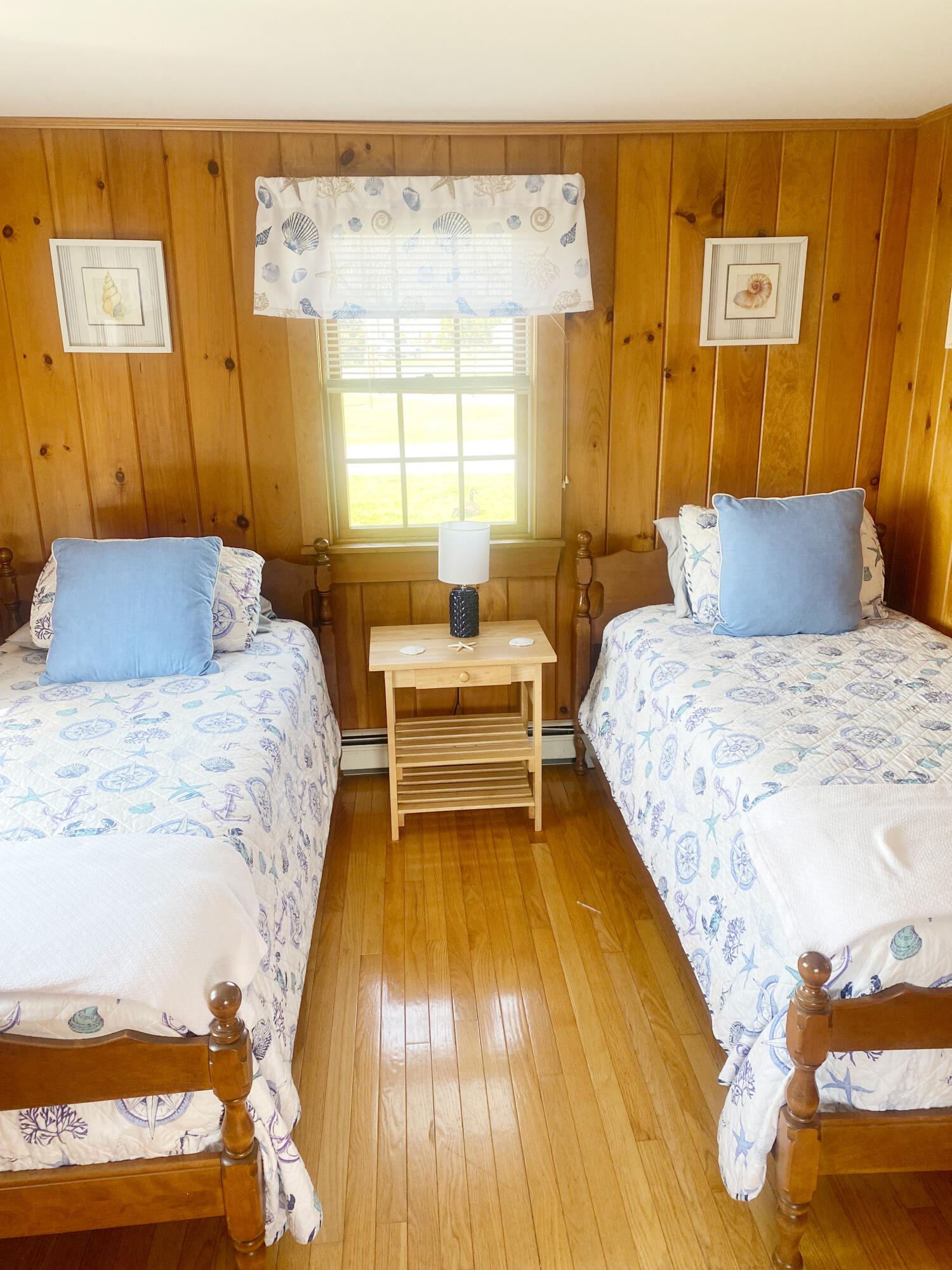 1090 Craigville Beach Road Centerville, MA 02632 - Photo 21 of 33 a bedroom with a bed and wooden floor