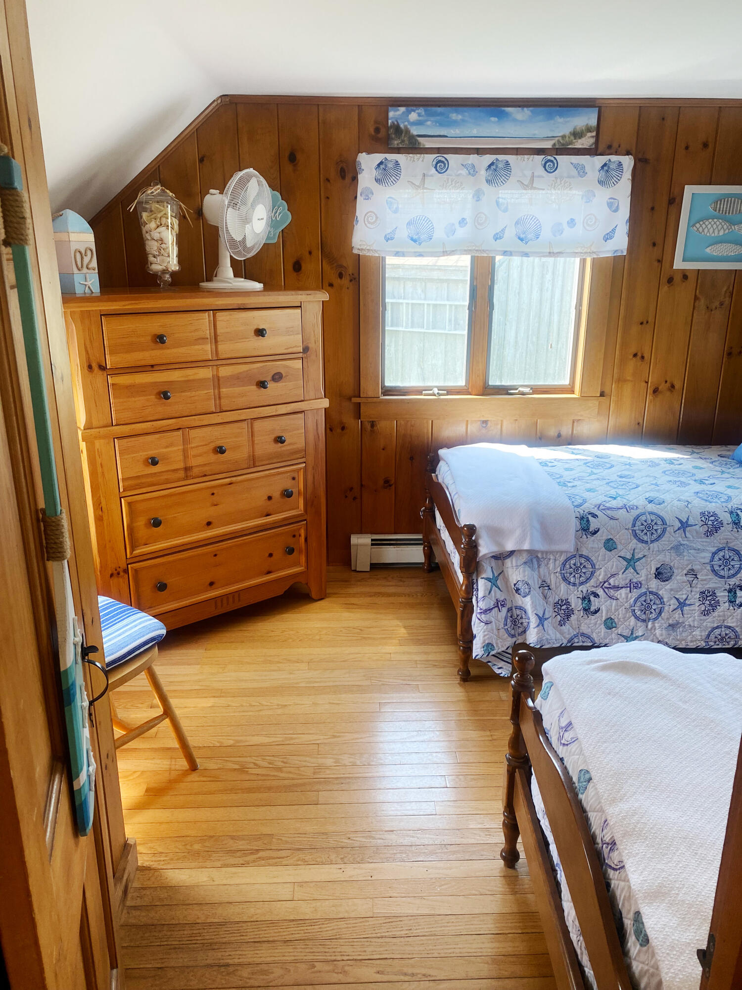 1090 Craigville Beach Road Centerville, MA 02632 - Photo 22 of 33 a bedroom with a bed and cabinet