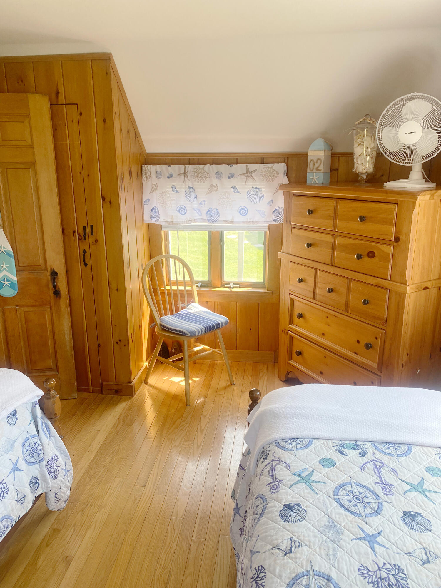 1090 Craigville Beach Road Centerville, MA 02632 - Photo 23 of 33 a bedroom with a bed and a dresser