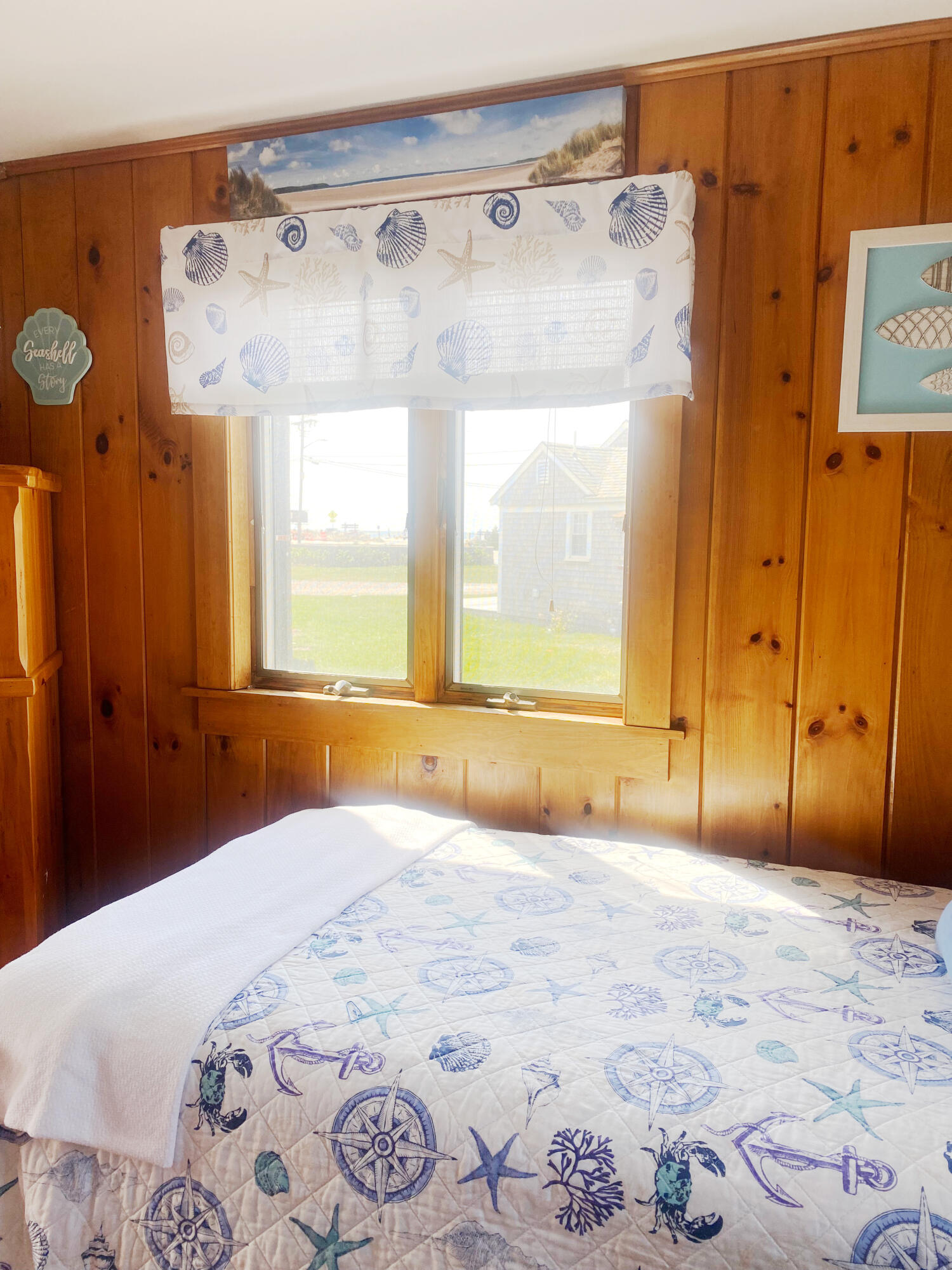 1090 Craigville Beach Road Centerville, MA 02632 - Photo 24 of 33 a bedroom with a bed and a window