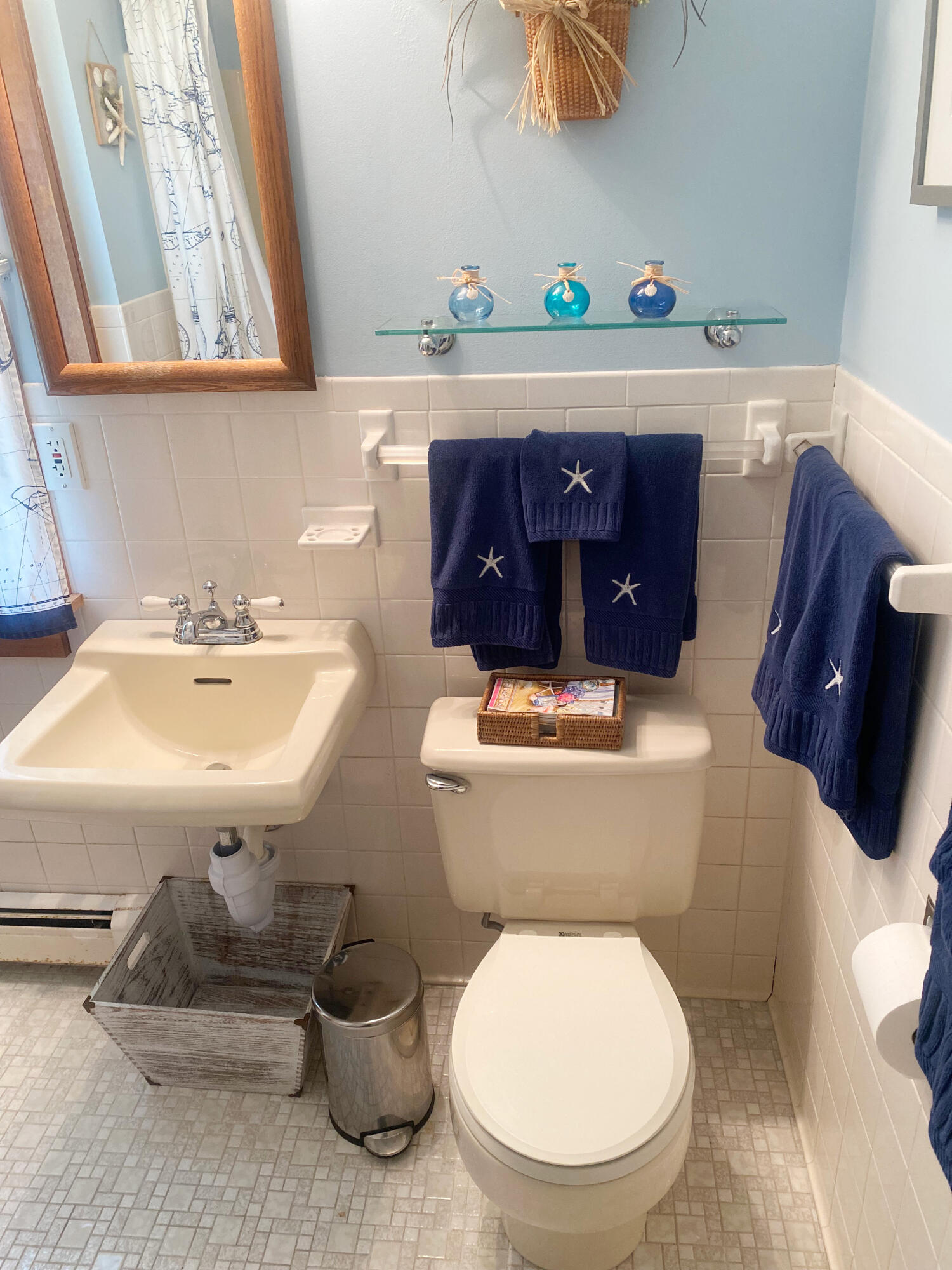 1090 Craigville Beach Road Centerville, MA 02632 - Photo 28 of 33 a bathroom with a toilet a sink and mirror