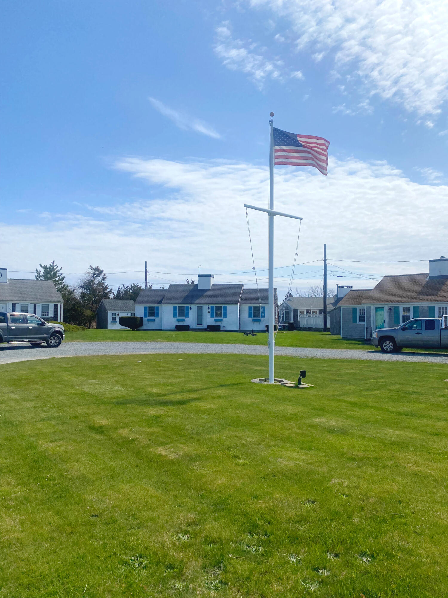1090 Craigville Beach Road Centerville, MA 02632 - Photo 4 of 33 a view of a lake with a building in the background