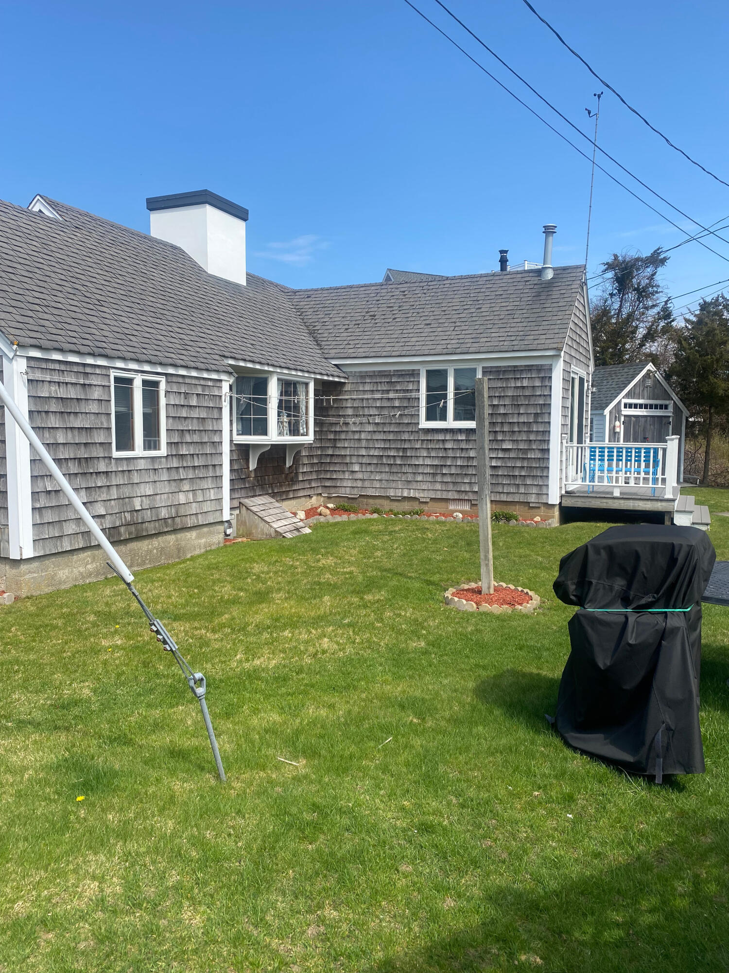 1090 Craigville Beach Road Centerville, MA 02632 - Photo 6 of 33 a backyard of a house with seating space