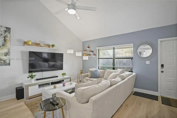 a living room with furniture and a flat screen tv