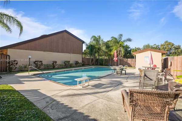 a view of a swimming pool with a patio