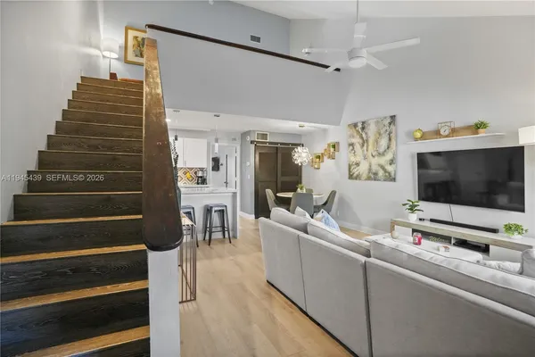 a living room with furniture and a flat screen tv