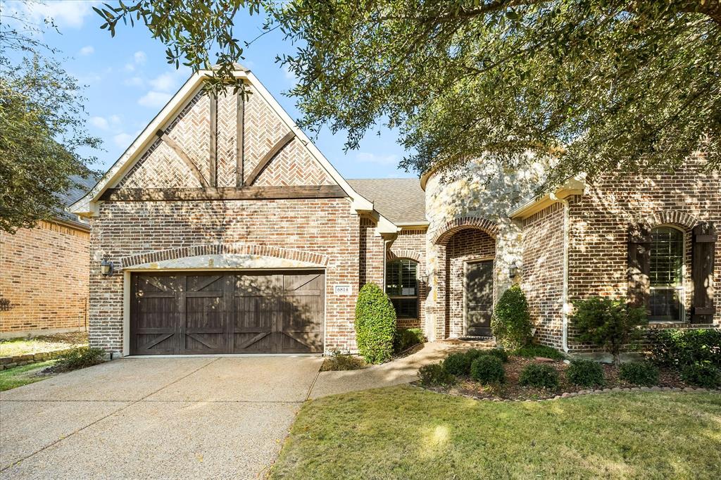 6814 Springwood Lane Garland, TX 75044 - Photo 1 of 35 a view of the house with a yard and garage