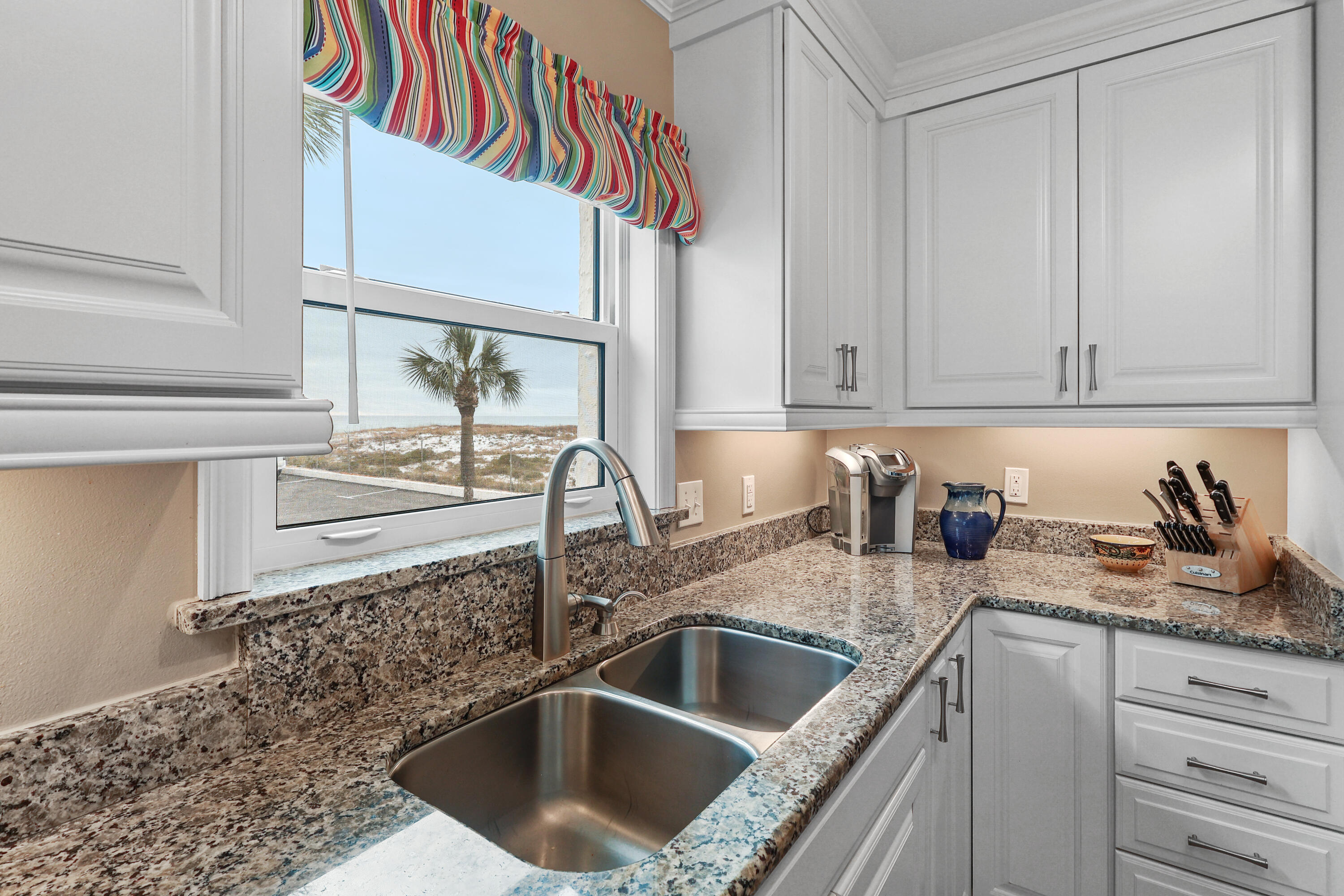 909 Santa Rosa Boulevard, Unit 229 Fort Walton Beach, FL 32548 - Photo 17 of 48 a kitchen with a sink and cabinets