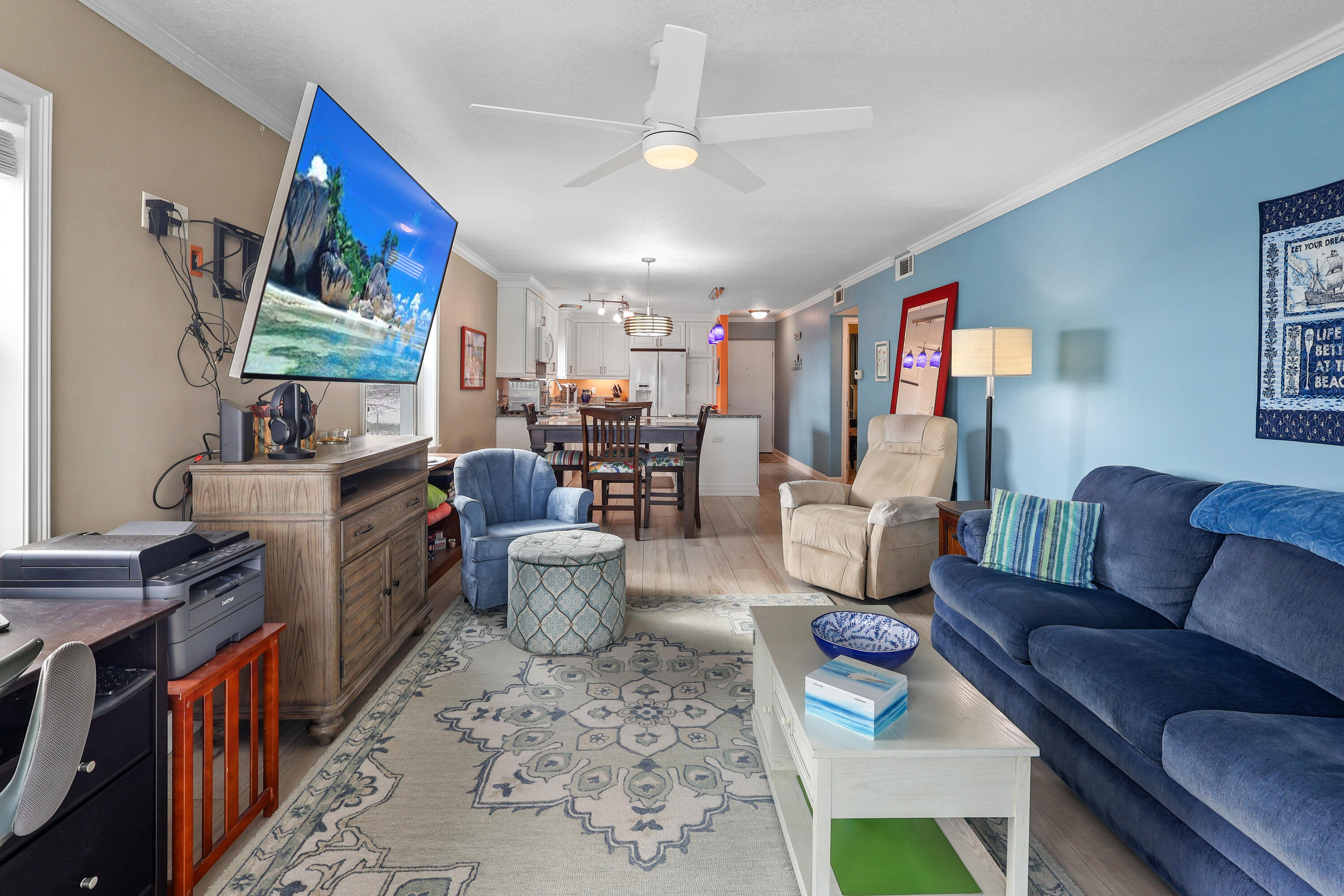 909 Santa Rosa Boulevard, Unit 229 Fort Walton Beach, FL 32548 - Photo 19 of 48 a living room with furniture and a flat screen tv