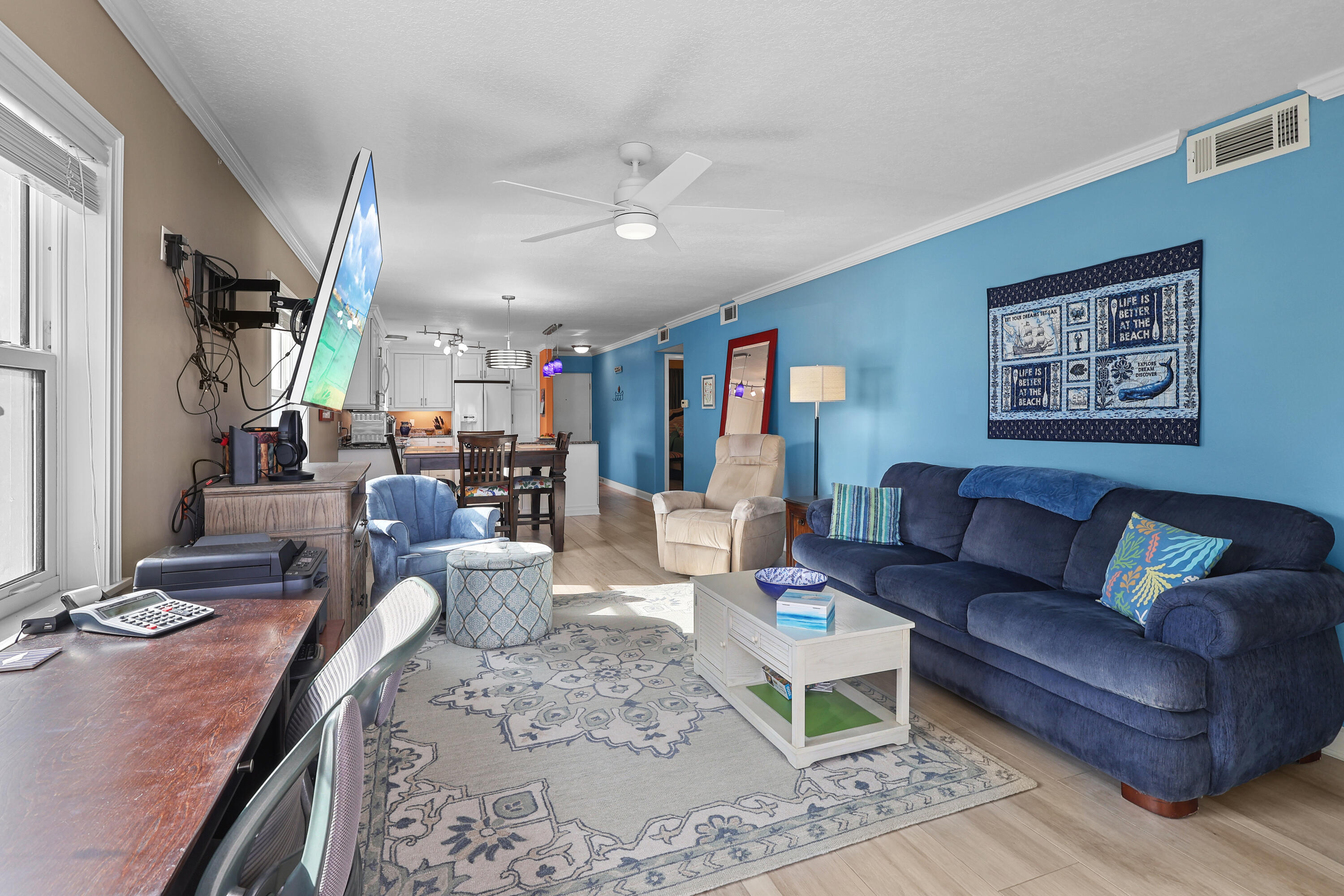 909 Santa Rosa Boulevard, Unit 229 Fort Walton Beach, FL 32548 - Photo 21 of 48 a living room with furniture and a chandelier