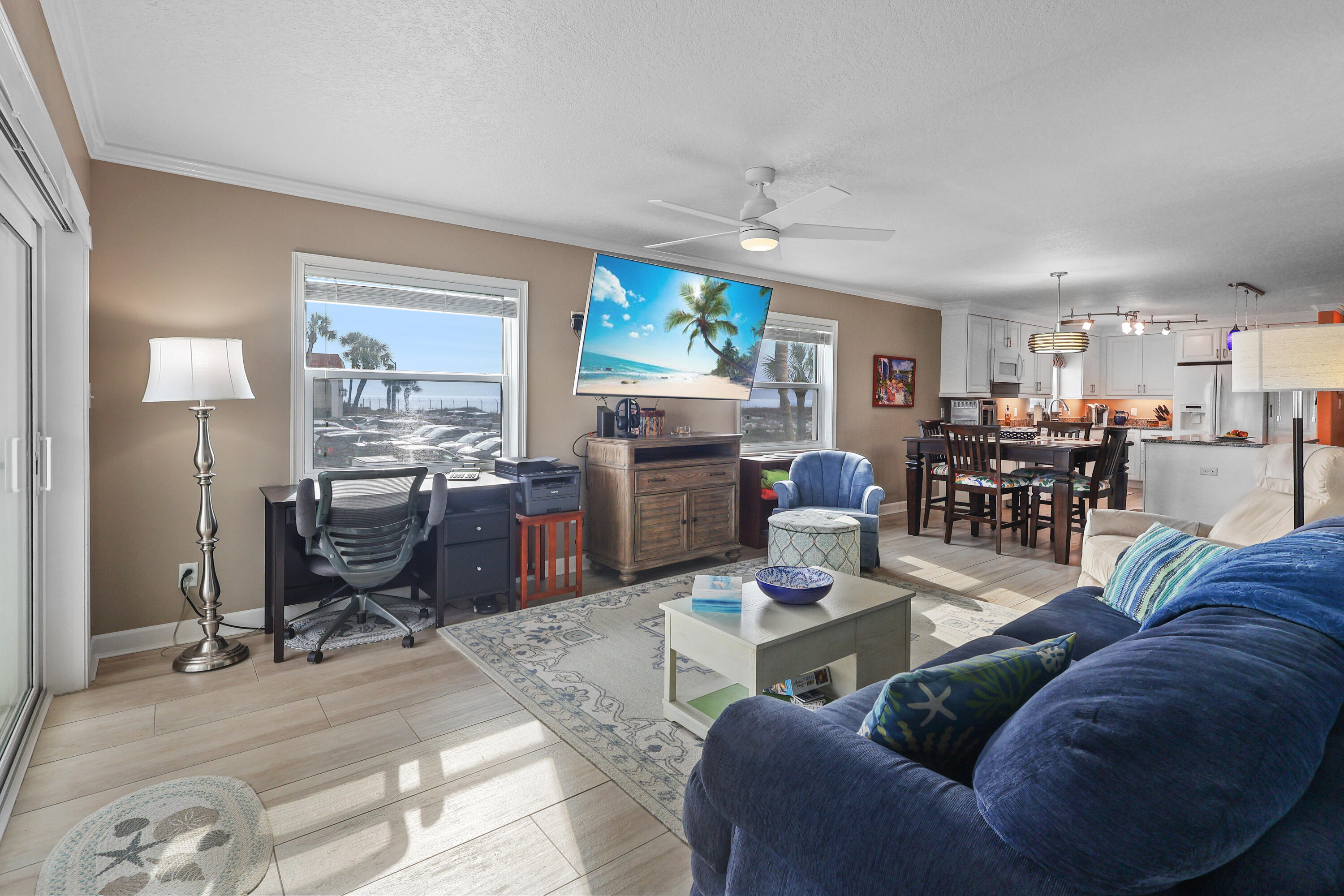 909 Santa Rosa Boulevard, Unit 229 Fort Walton Beach, FL 32548 - Photo 23 of 48 a living room with furniture a window and kitchen view