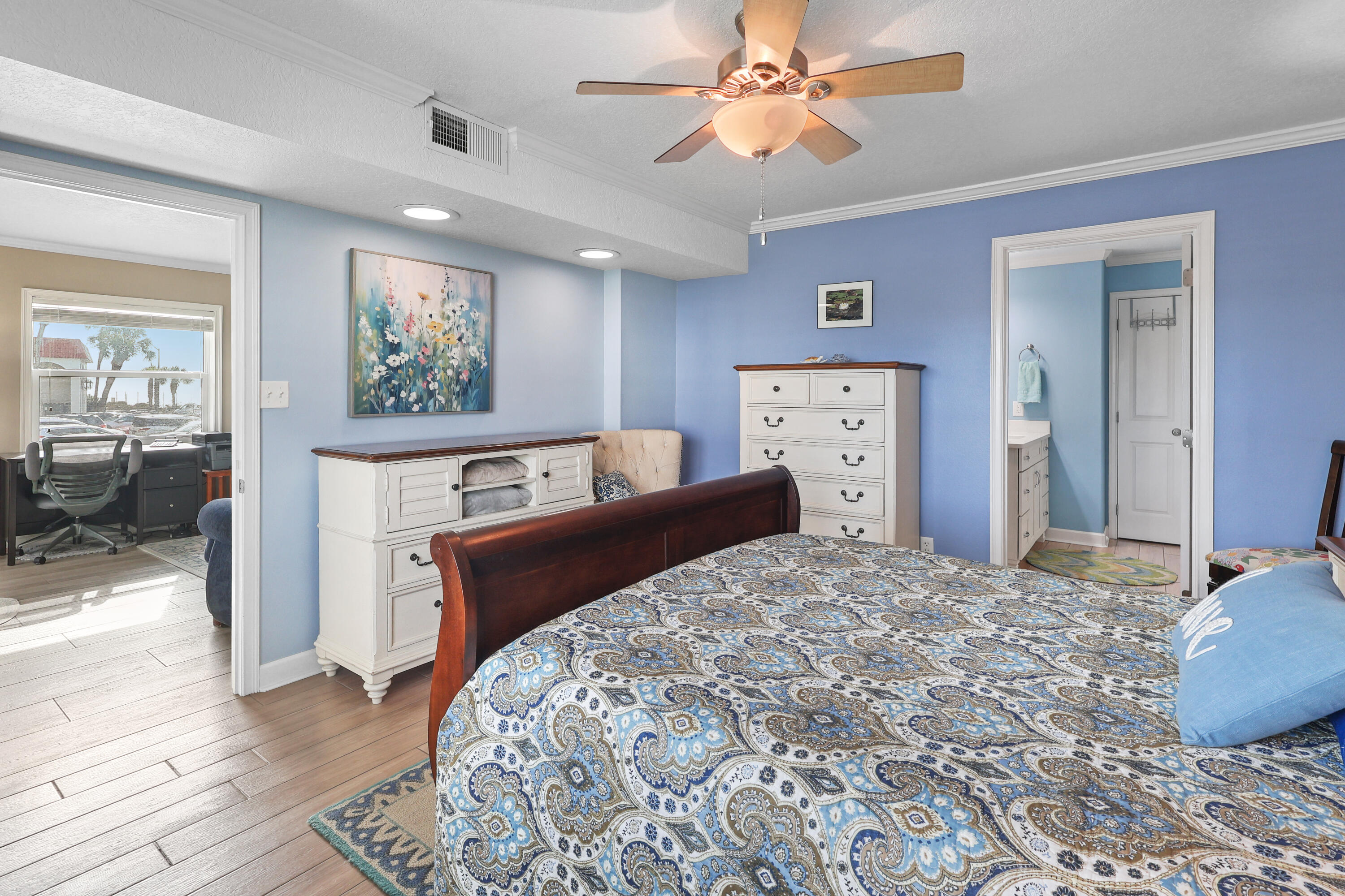 909 Santa Rosa Boulevard, Unit 229 Fort Walton Beach, FL 32548 - Photo 25 of 48 a bedroom with a large bed and a chandelier