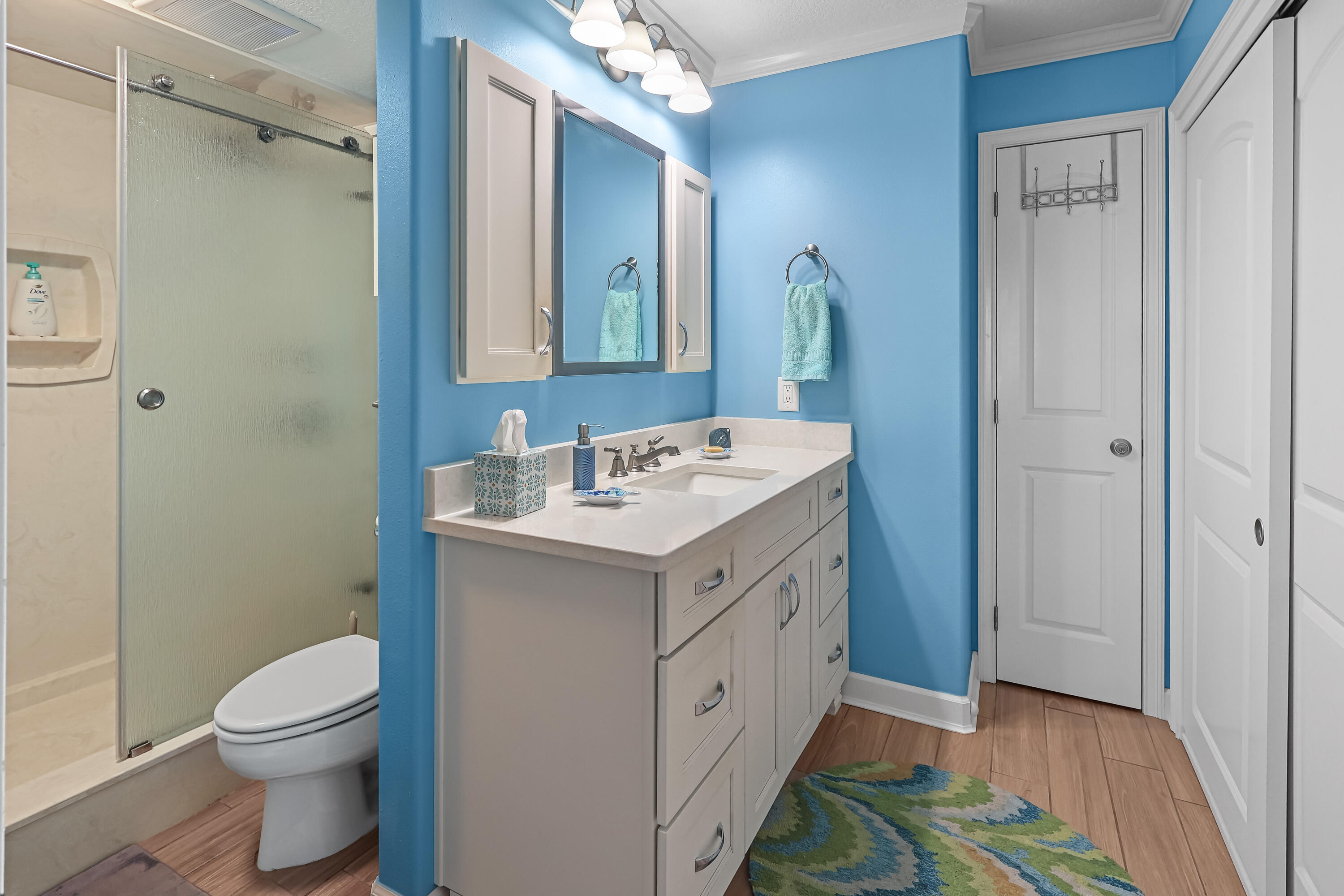 909 Santa Rosa Boulevard, Unit 229 Fort Walton Beach, FL 32548 - Photo 30 of 48 a bathroom with a sink toilet and shower