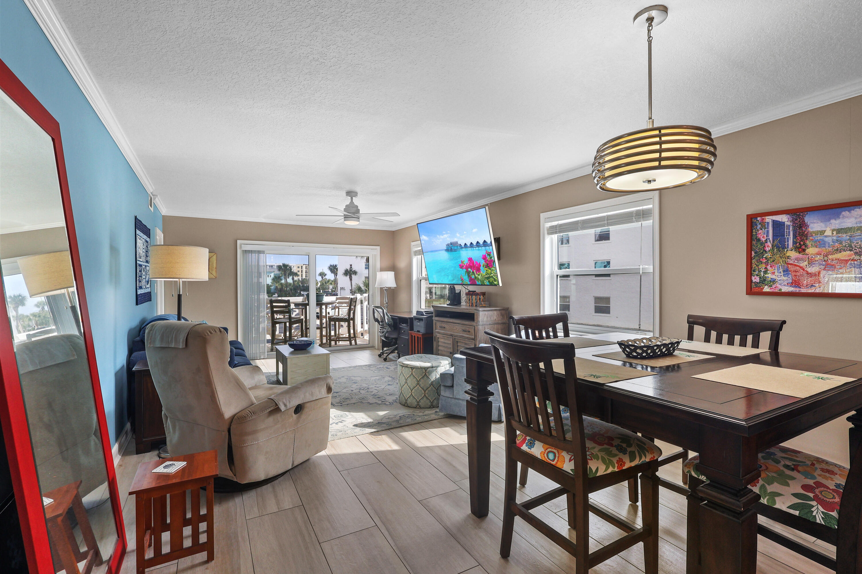 909 Santa Rosa Boulevard, Unit 229 Fort Walton Beach, FL 32548 - Photo 3 of 48 a dining room with furniture and wooden floor