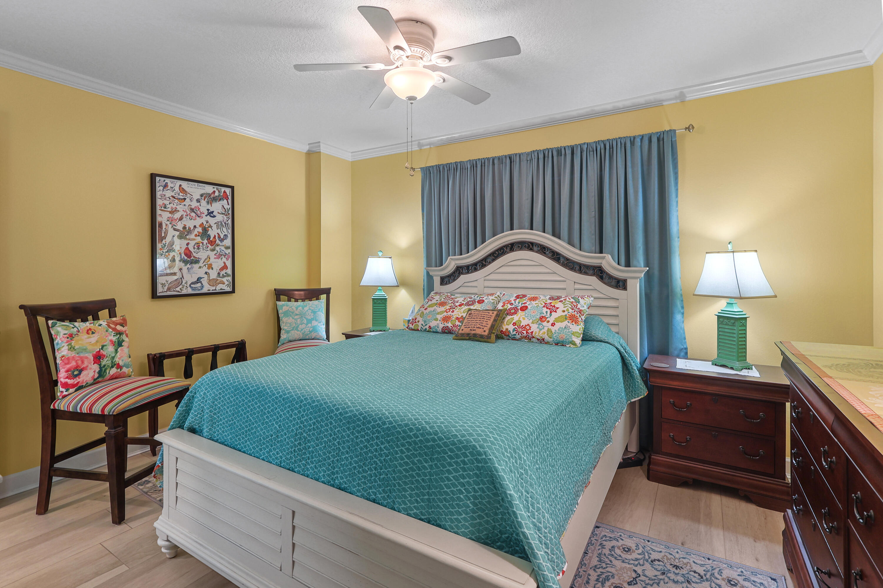 909 Santa Rosa Boulevard, Unit 229 Fort Walton Beach, FL 32548 - Photo 31 of 48 a bedroom with a bed and a chandelier