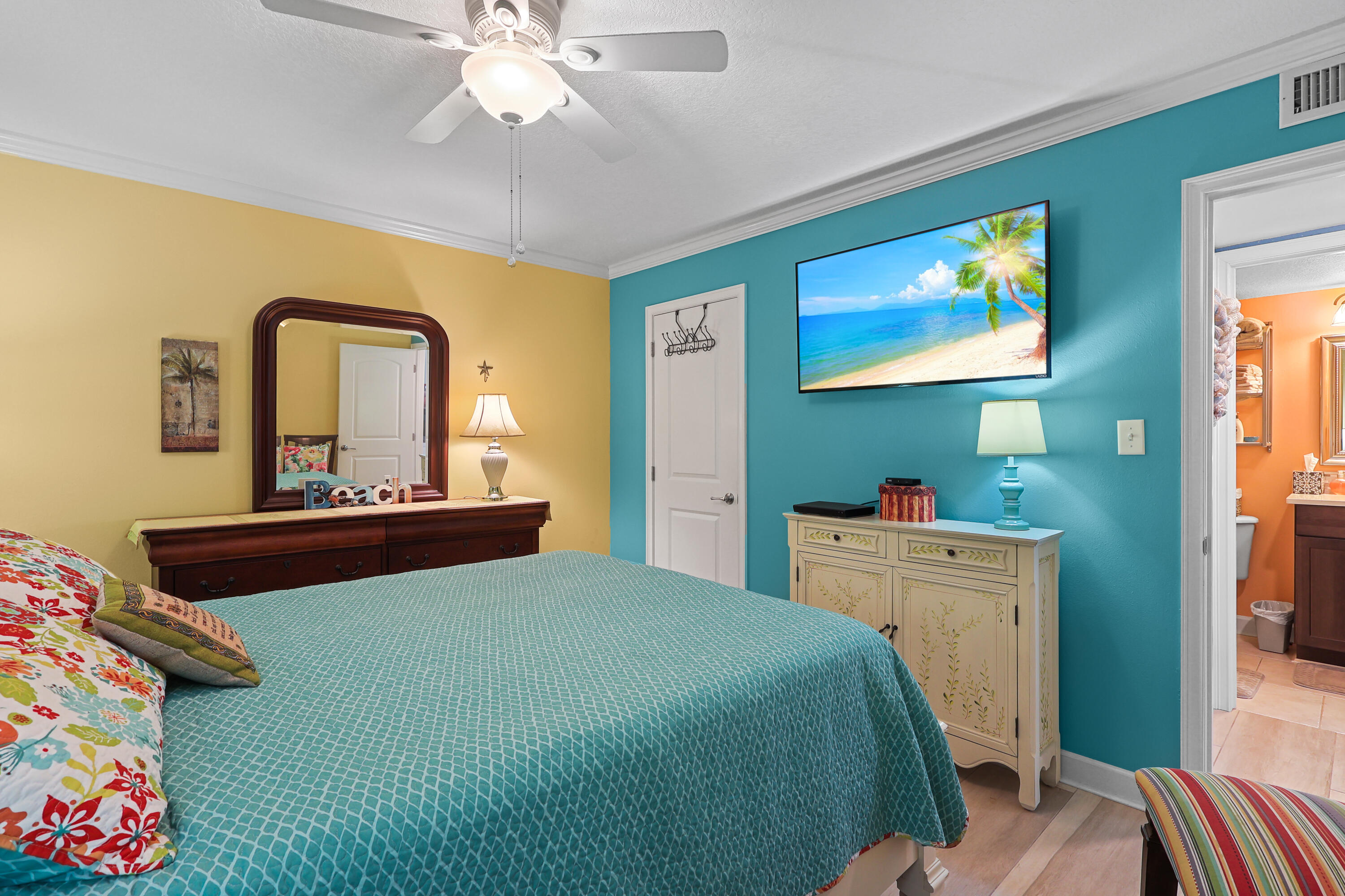 909 Santa Rosa Boulevard, Unit 229 Fort Walton Beach, FL 32548 - Photo 32 of 48 a bedroom with a bed and a chandelier