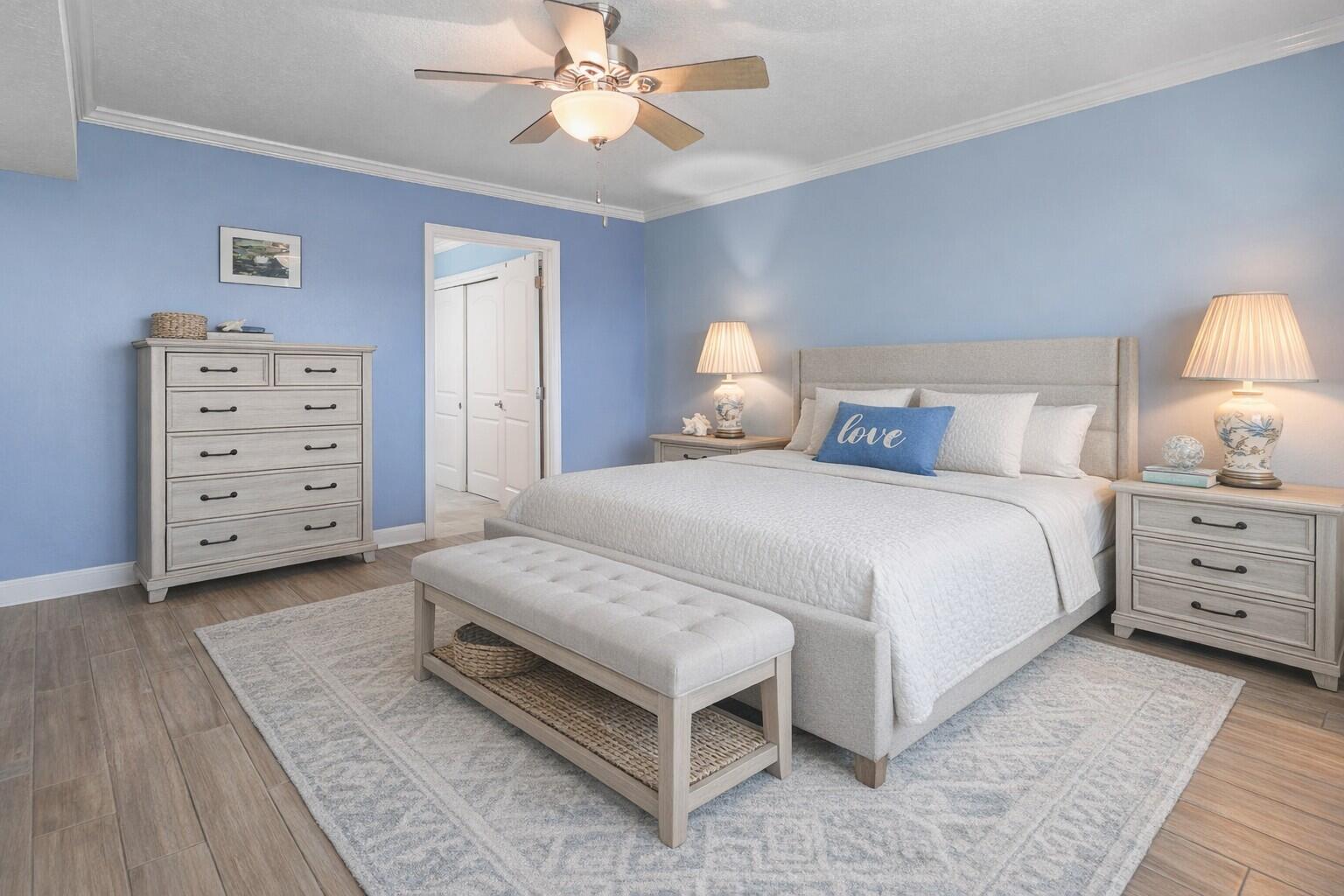 909 Santa Rosa Boulevard, Unit 229 Fort Walton Beach, FL 32548 - Photo 37 of 48 a bedroom with a bed and a chandelier