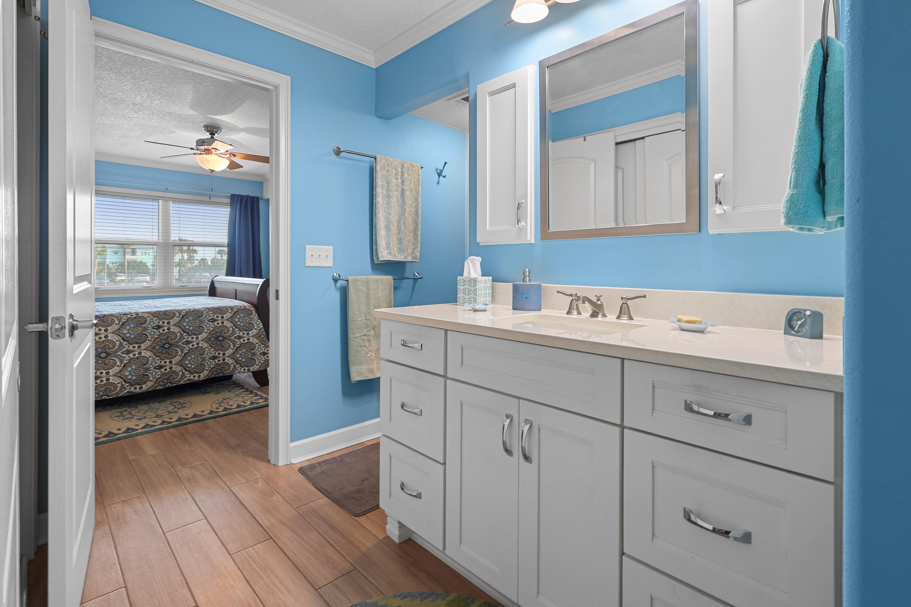 909 Santa Rosa Boulevard, Unit 229 Fort Walton Beach, FL 32548 - Photo 7 of 48 a en suite bathroom with sink and mirror