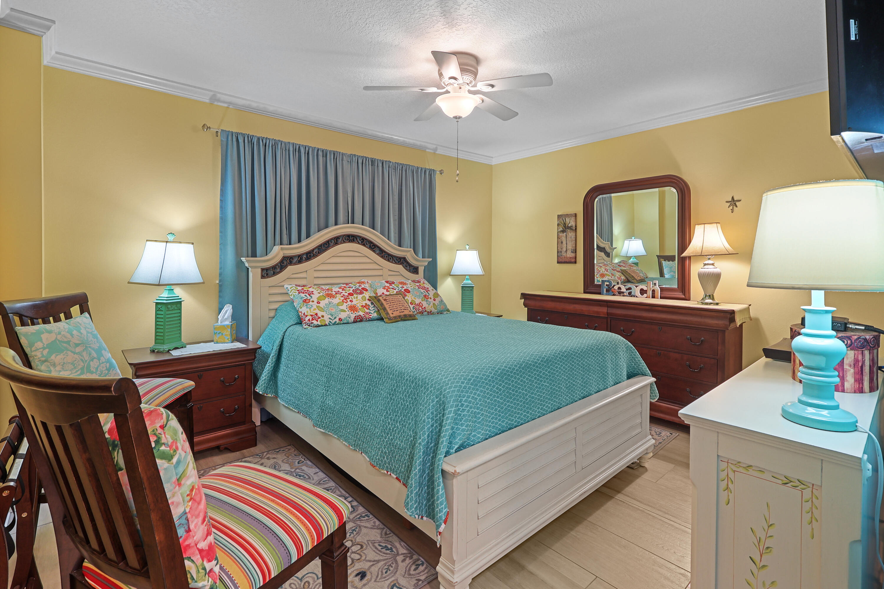 909 Santa Rosa Boulevard, Unit 229 Fort Walton Beach, FL 32548 - Photo 8 of 48 a bedroom with a bed and a chandelier