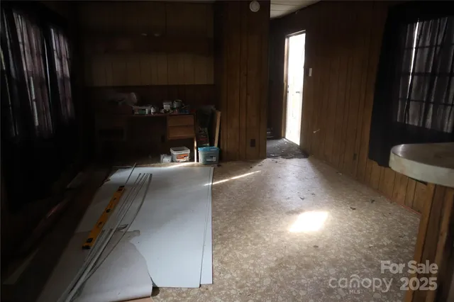 a view of hall way with furniture