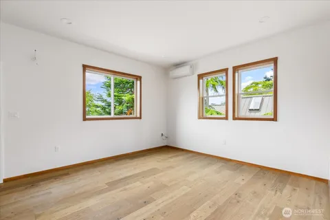 a kitchen with a refrigerator sink and cabinets