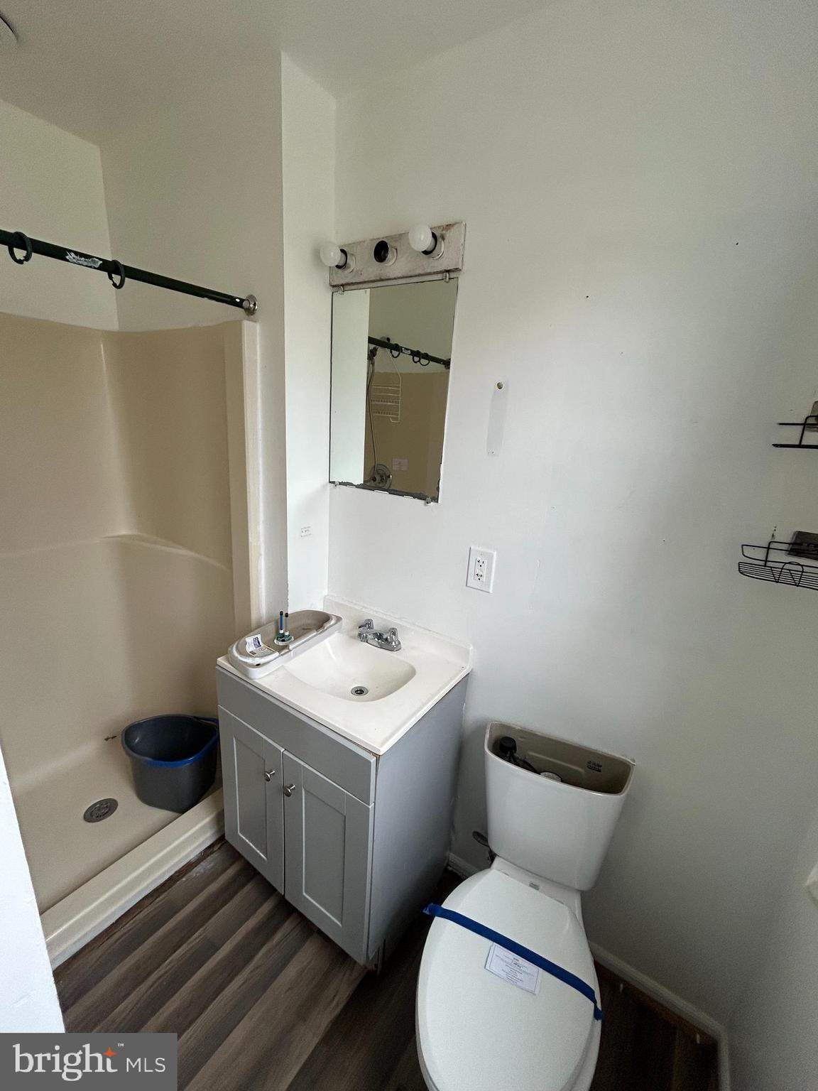 608 Spring Garden Avenue Salisbury, MD 21804 - Photo 14 of 19 a bathroom with a sink toilet and mirror