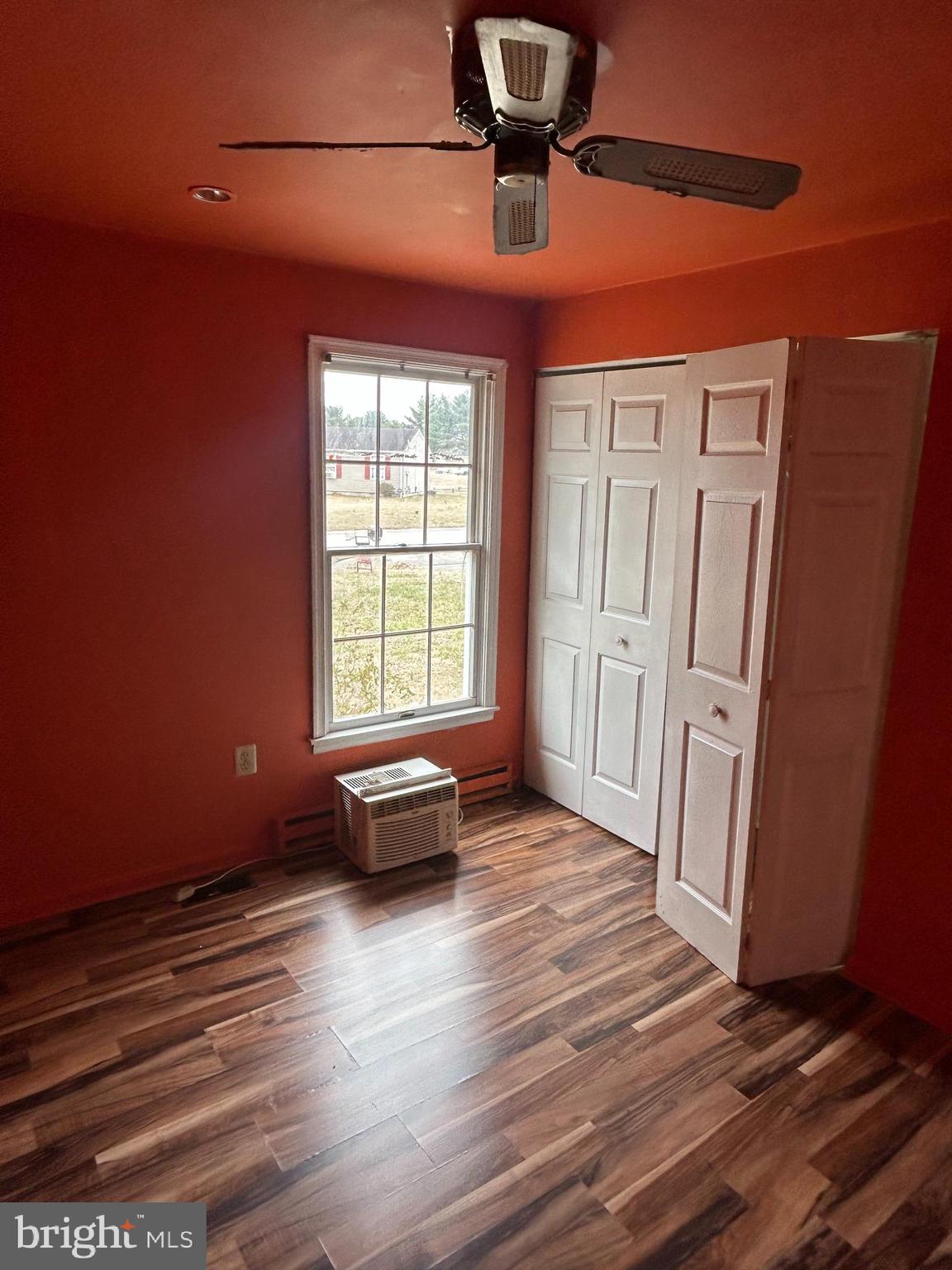 608 Spring Garden Avenue Salisbury, MD 21804 - Photo 15 of 19 en empty room with wooden floor and window