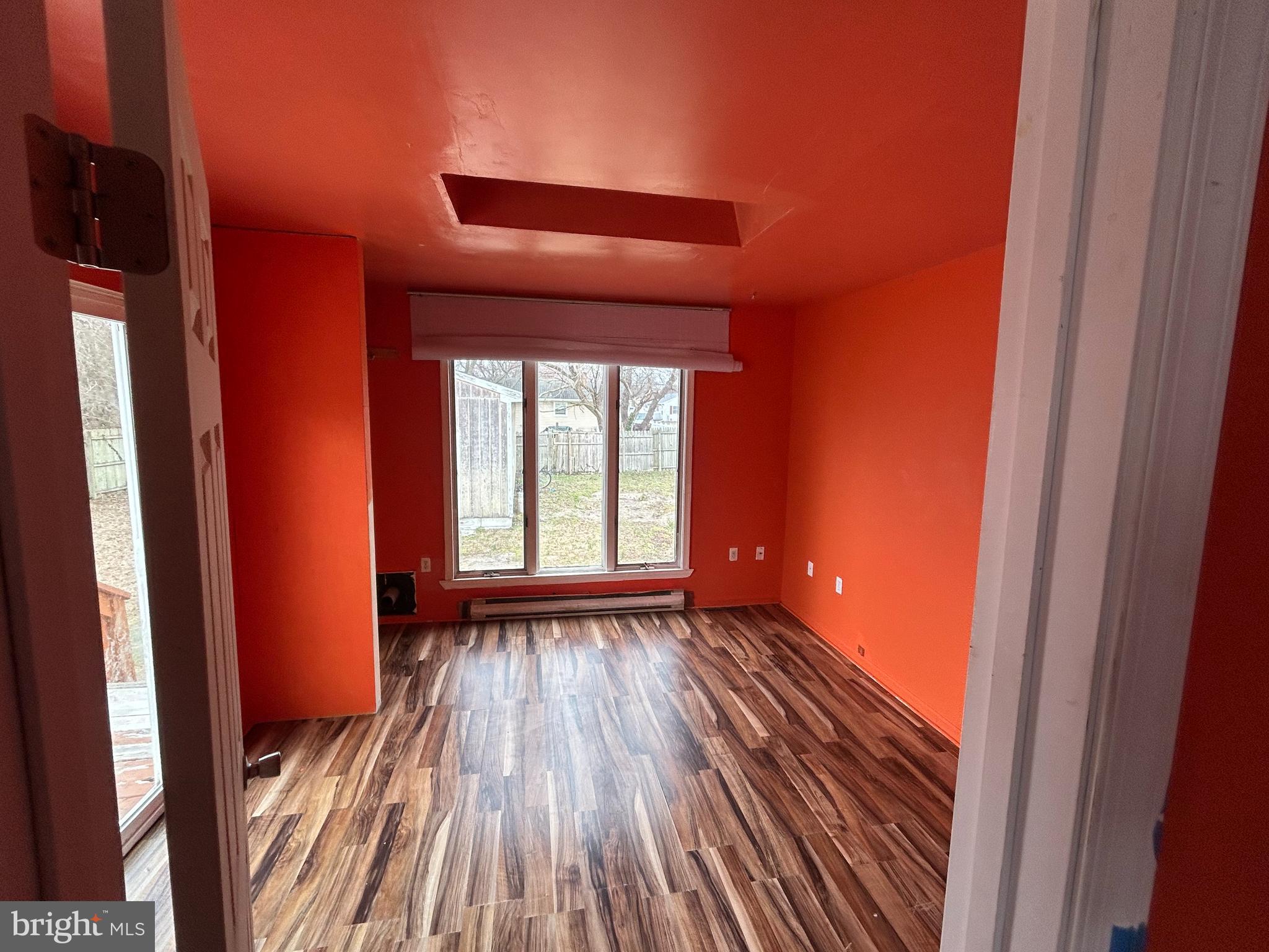 608 Spring Garden Avenue Salisbury, MD 21804 - Photo 18 of 19 a view of an empty room with wooden floor and a window