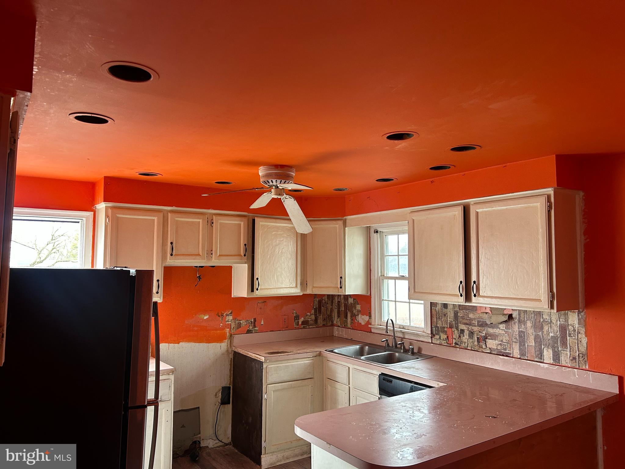 608 Spring Garden Avenue Salisbury, MD 21804 - Photo 5 of 19 a kitchen with stainless steel appliances a sink stove and refrigerator