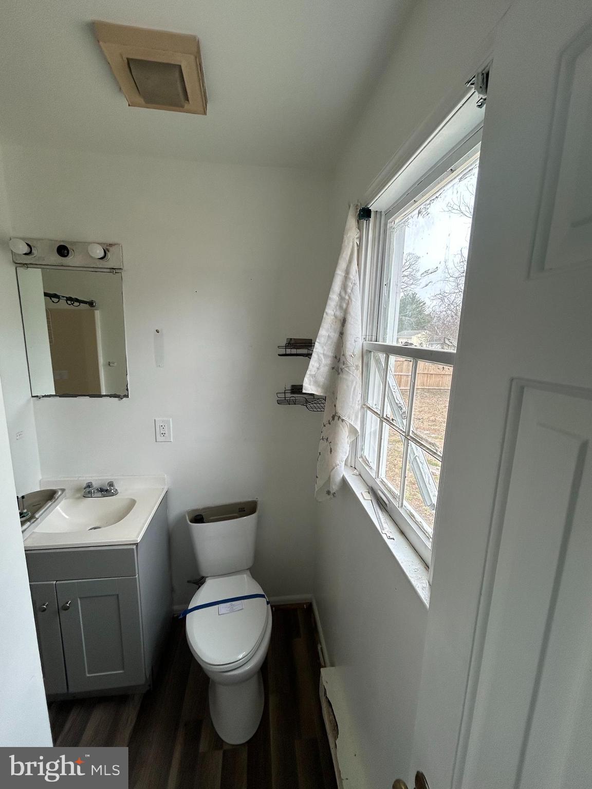 608 Spring Garden Avenue Salisbury, MD 21804 - Photo 10 of 19 a bathroom with a toilet sink and mirror