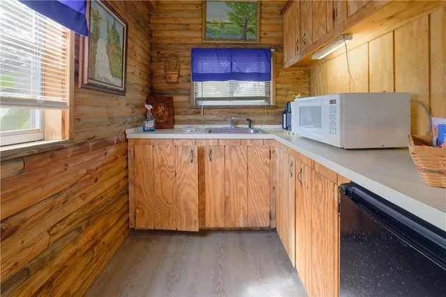 a bathroom with a granite countertop toilet sink and mirror