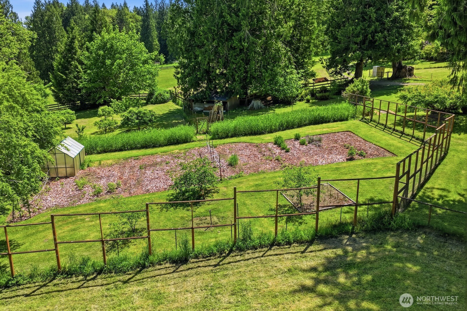 30130 Southeast Issaquah-Fall City Road Fall City, WA 98024 - Photo 26 of 39 a view of a garden with a bench