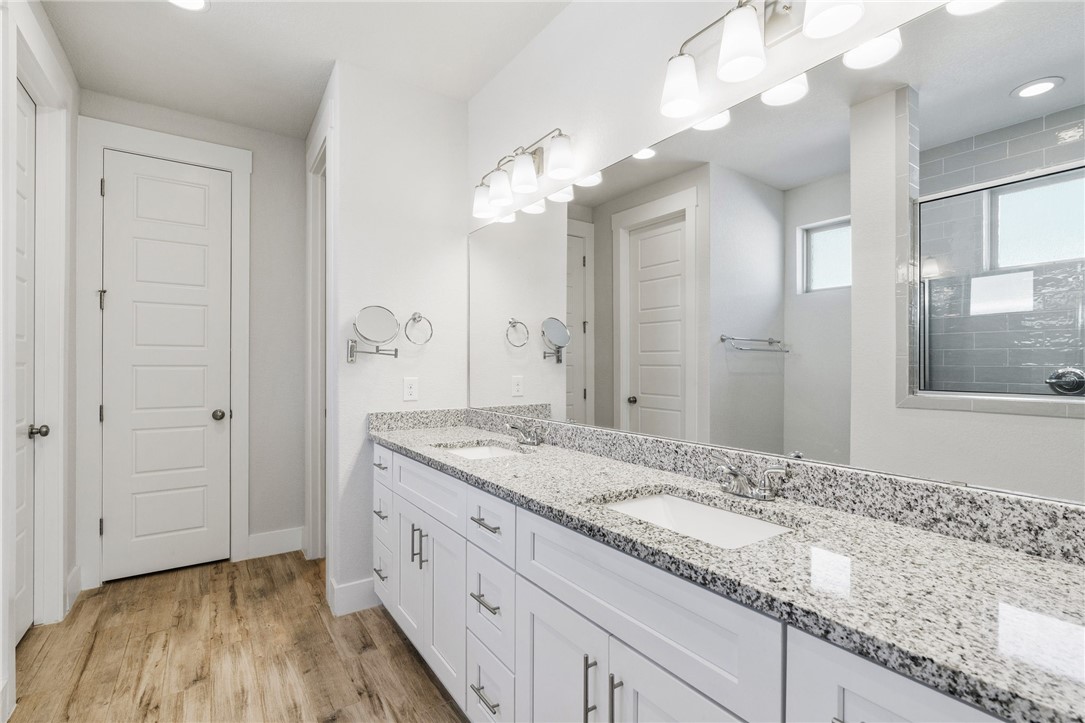 941 Del Raphael Drive Leander, TX 78641 - Photo 15 of 33 A dual-sink vanity means no one is fighting for elbow room while getting ready in the morning