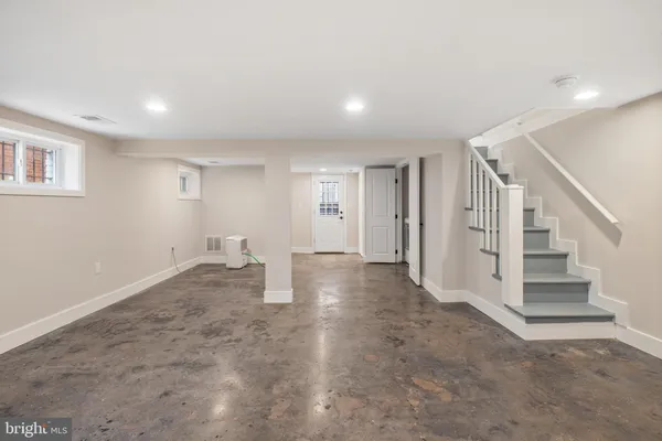 a view of a livingroom with stairs