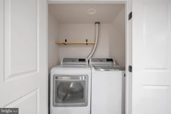 a view of a patio with a table and chairs