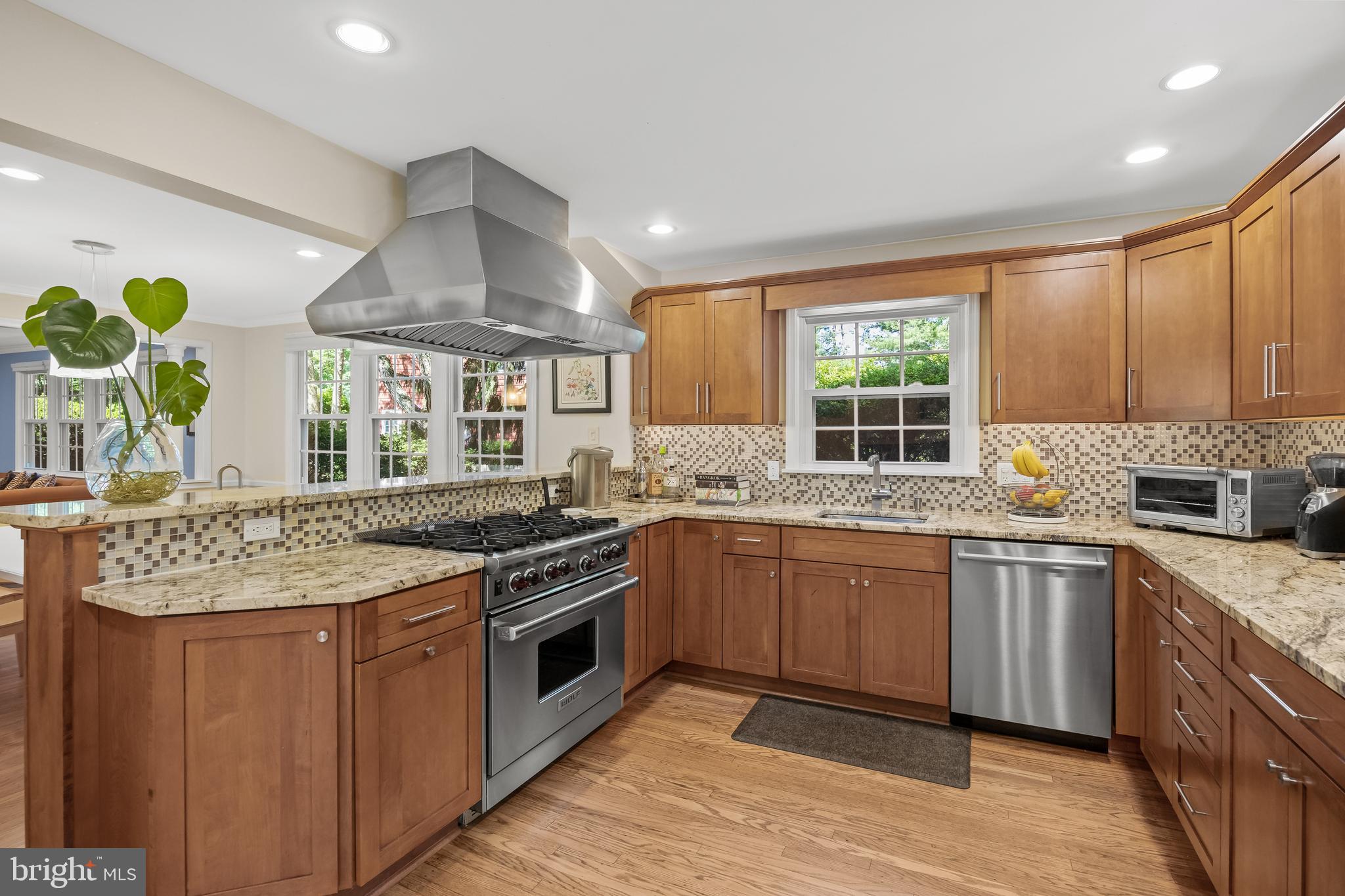4 Rooftree Road Cherry Hill, NJ 08003 - Photo 12 of 42 a kitchen with stainless steel appliances granite countertop wooden cabinets and a stove top oven