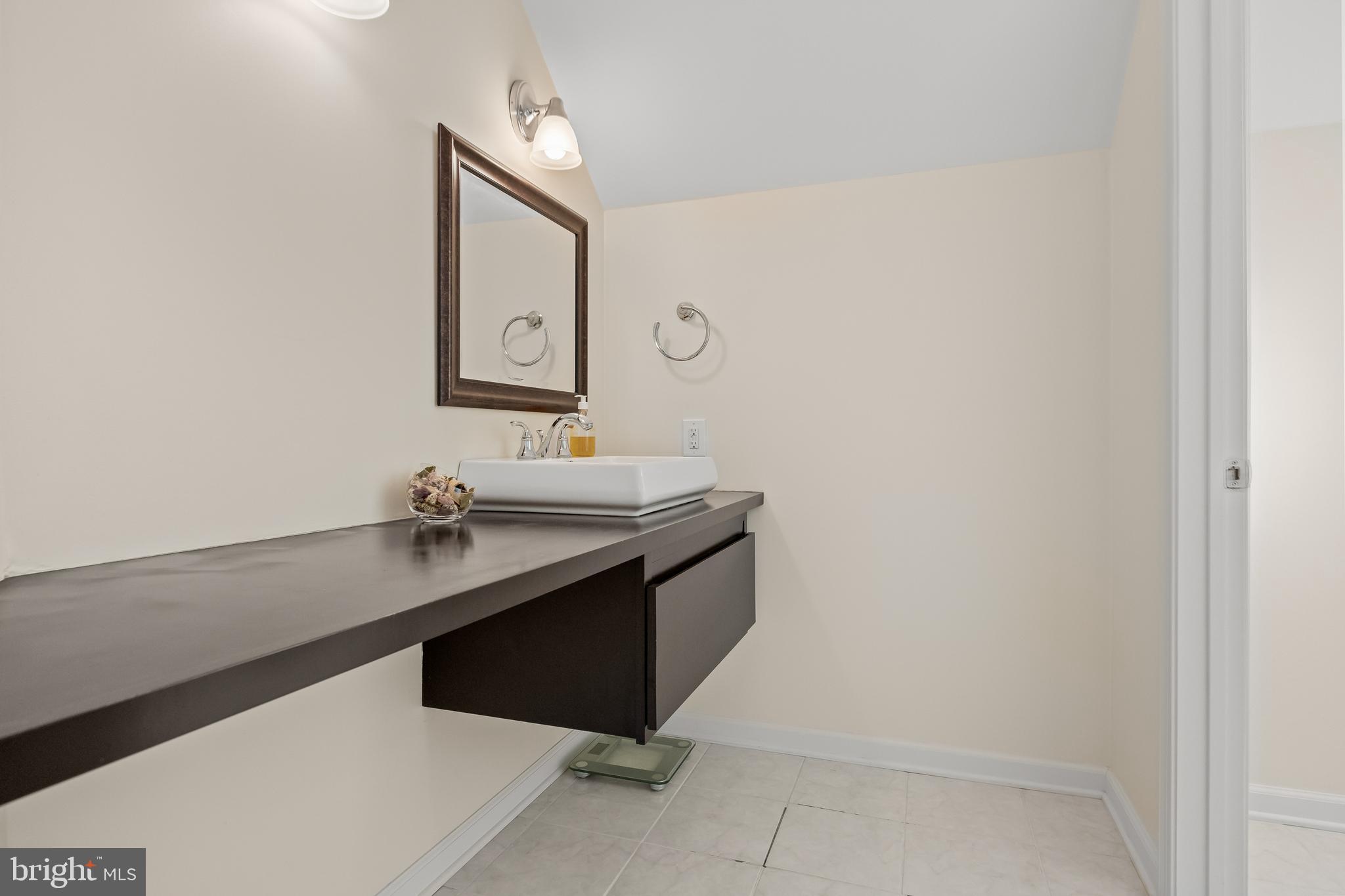 4 Rooftree Road Cherry Hill, NJ 08003 - Photo 28 of 42 a bathroom with a granite countertop sink and a mirror