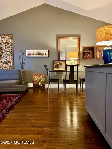 a living room with fireplace furniture and a table