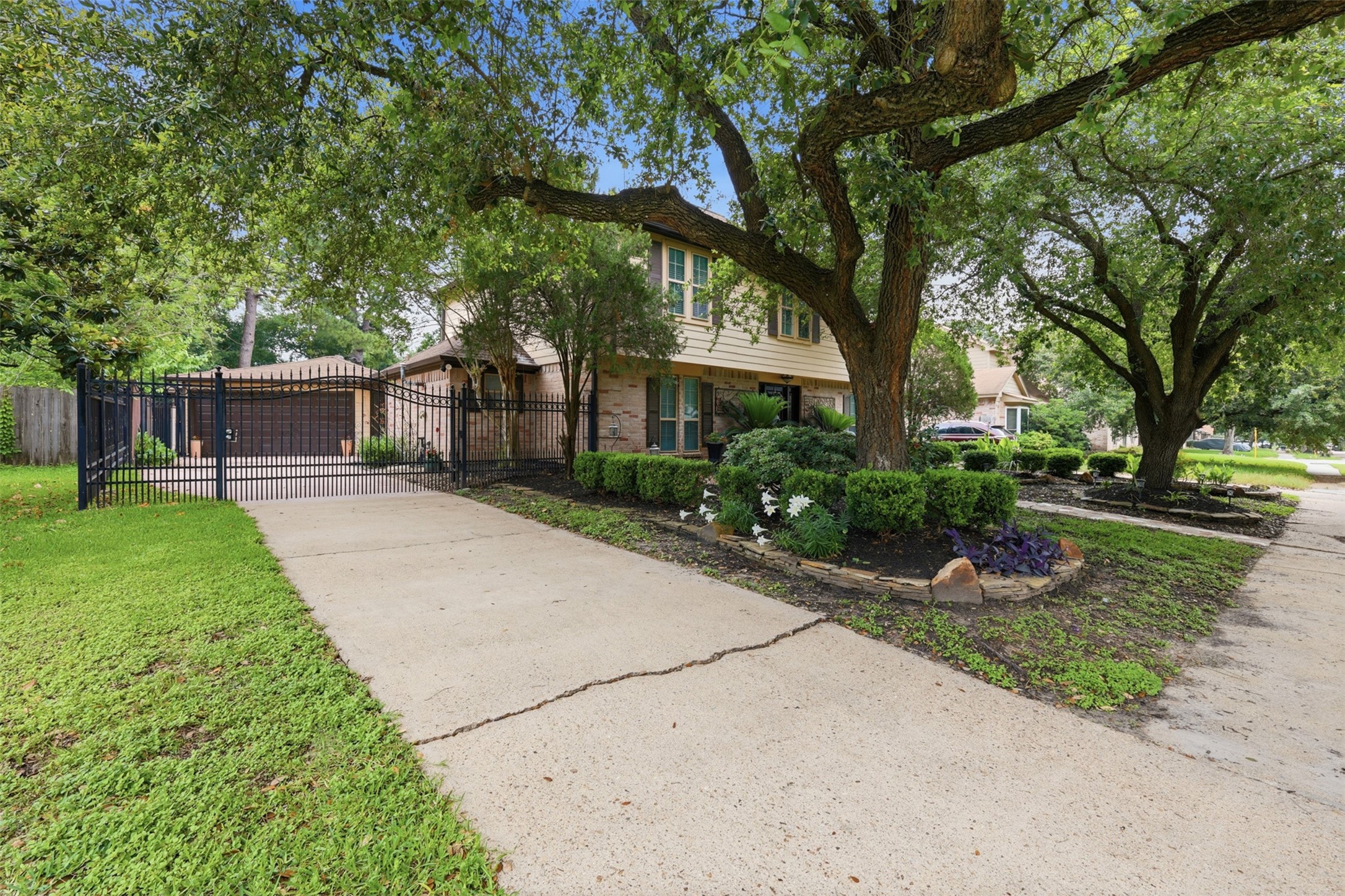 7010 River Mill Drive Spring, TX 77379 - Photo 3 of 29 a front view of a house with a garden