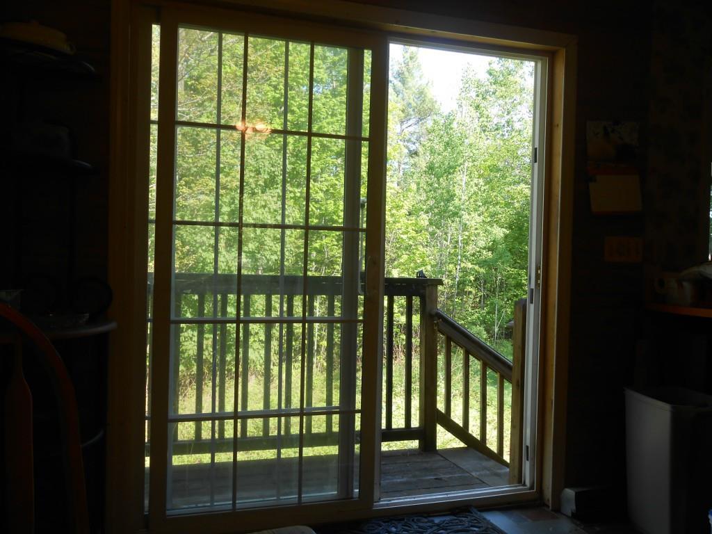 109 Dudley Road Bryant Pond, ME 04219 - Photo 10 of 31 Lots of green outside. New porch in...