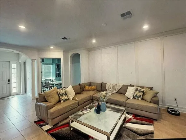 a living room with furniture and a couch