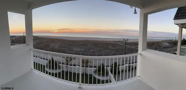a bathroom with a shower and a sink